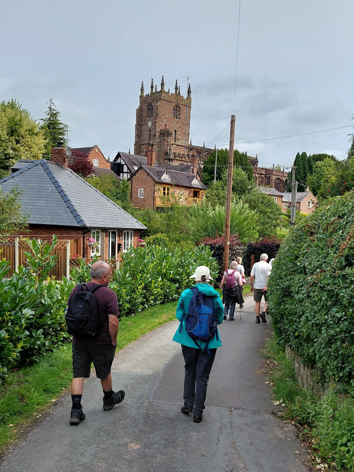 Crewe and Nantwich Ramblers Thursday Walkers approaching Bunbury Church